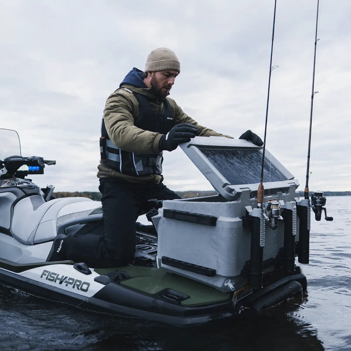 Sea-Doo LinQ cooler 13.5 gal with double latches mounted on a Fish Pro jet ski; person opening the lid.