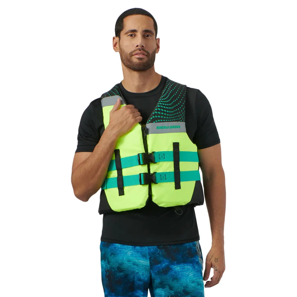 Sea-Doo Motion PFD life jacket in neon yellow with teal straps worn by man