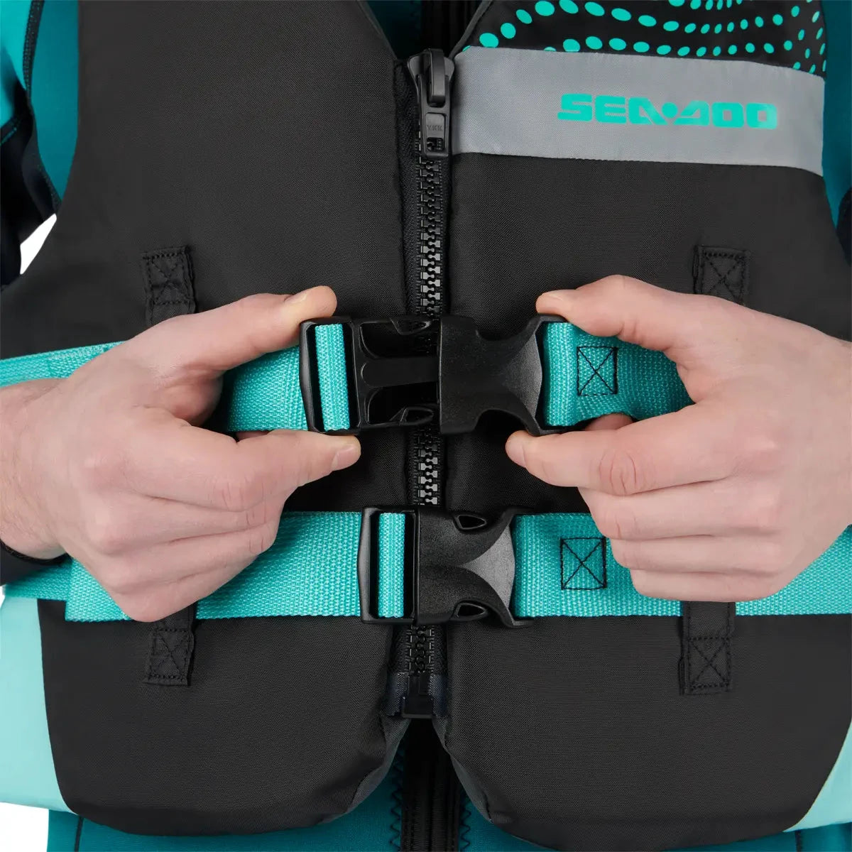 Sea-Doo Motion Life Jacket Aqua riding gear with teal straps and Sea-Doo logo.