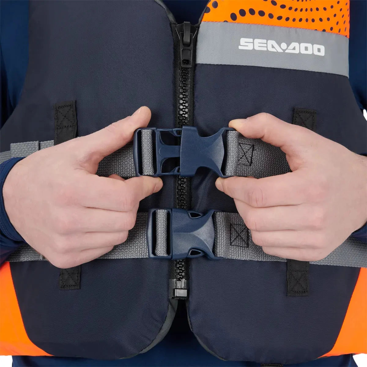 Sea-Doo Motion PFD Life Jacket orange with blue quick-release buckles and gray straps, BRP branding