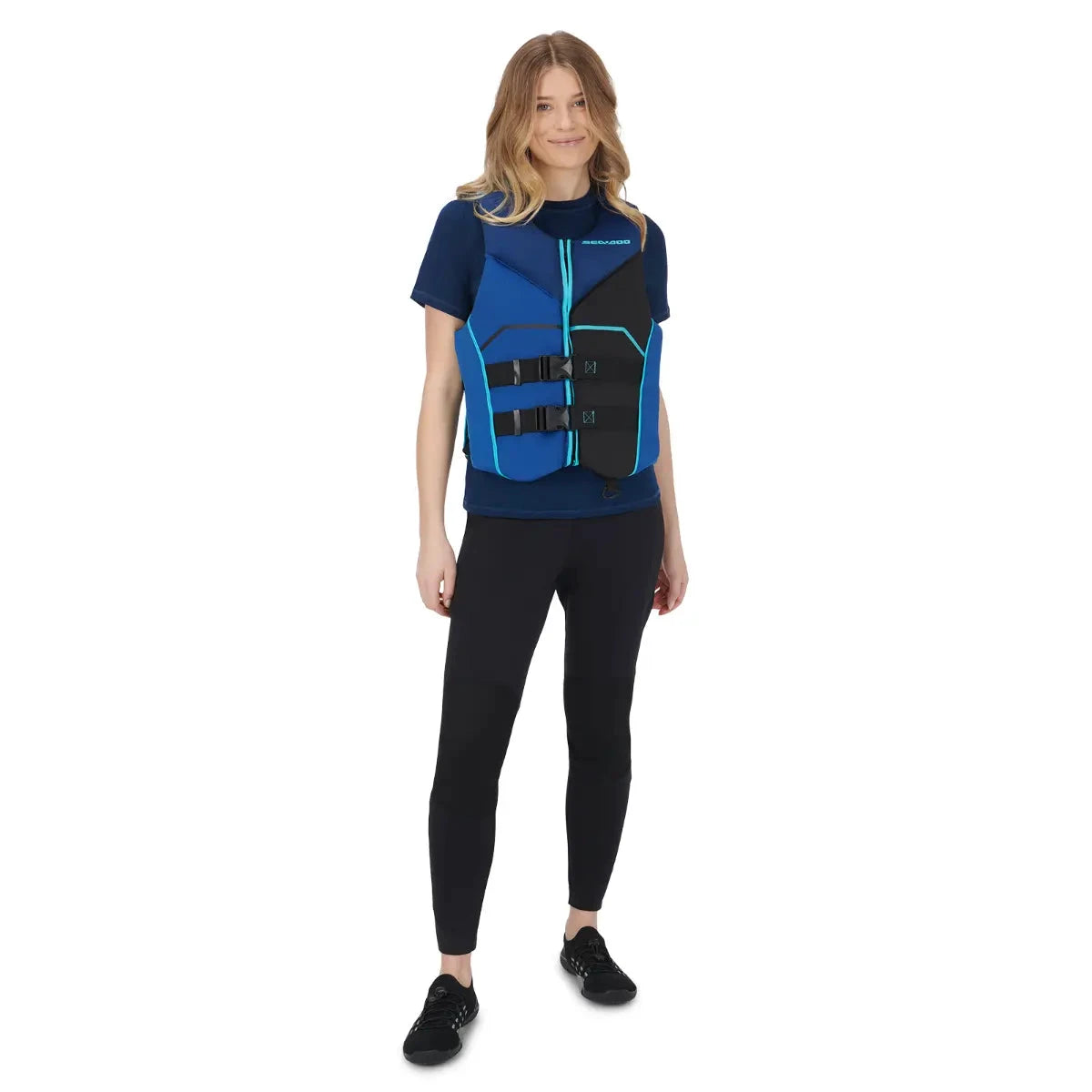 Sea-Doo Freedom PFD blue life jacket by BRP; blue and black with teal trim on wearer