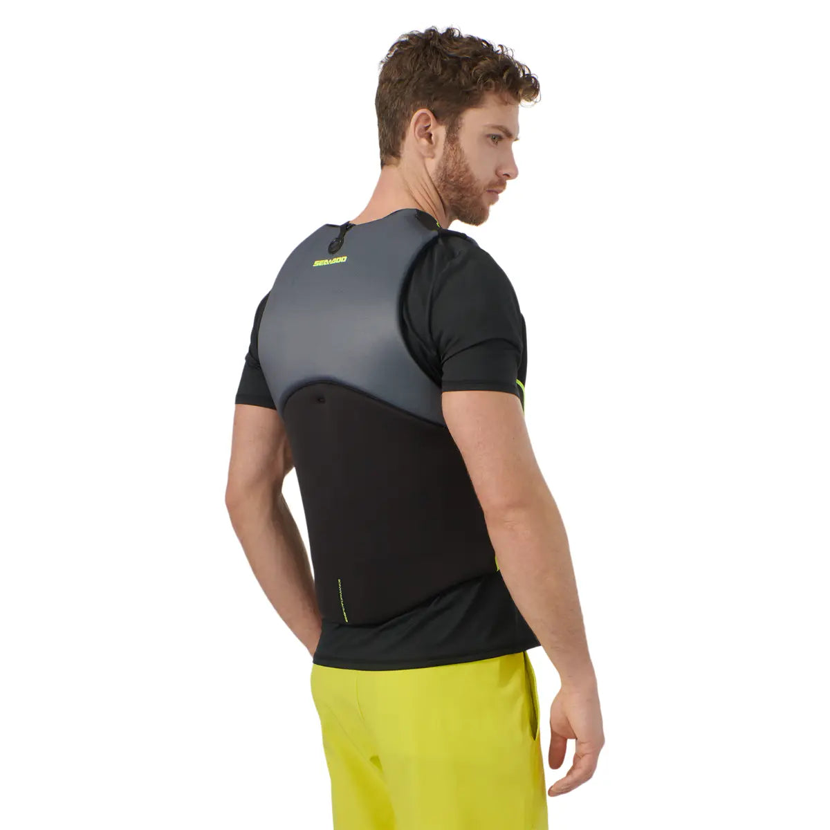 Sea-Doo Freedom PFD Black life jacket; black body with gray upper panel worn by a man.