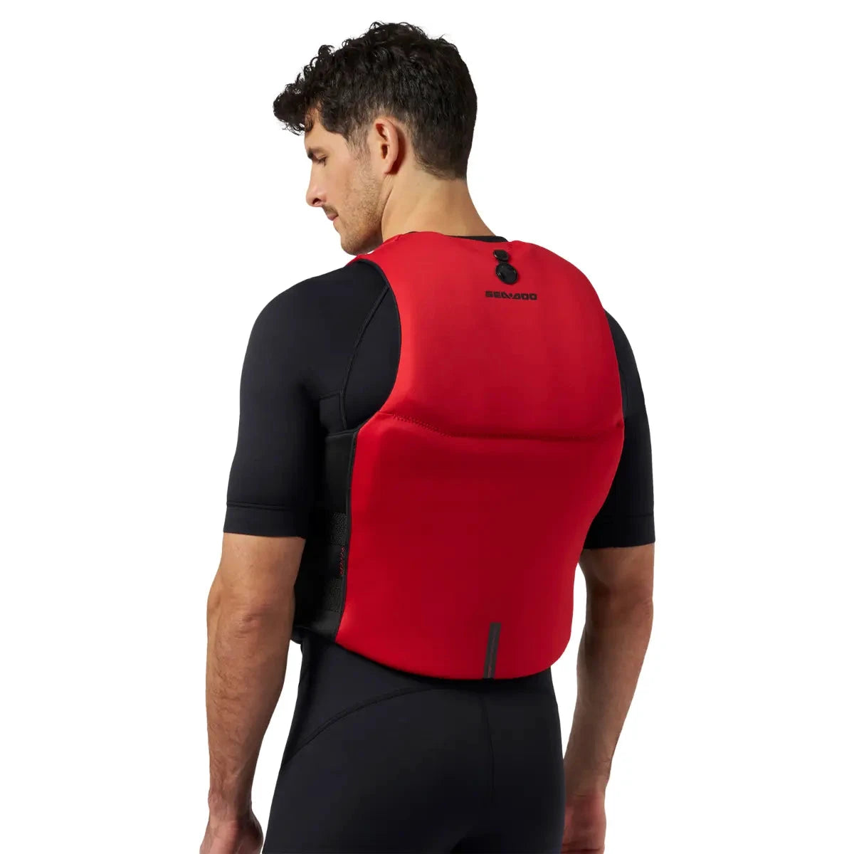 Sea-Doo Wave Life Jacket/PFD in red with BRP branding, worn over a black wetsuit.