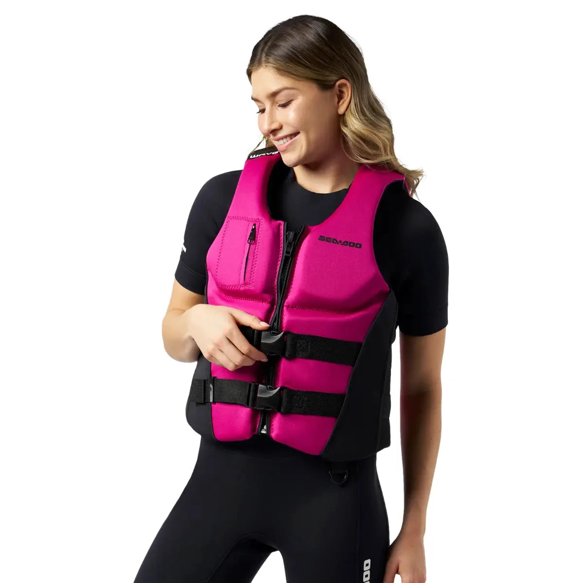 Sea-Doo Wave Life Jacket/PFD in pink with black side panels, front zipper and two strap buckles.