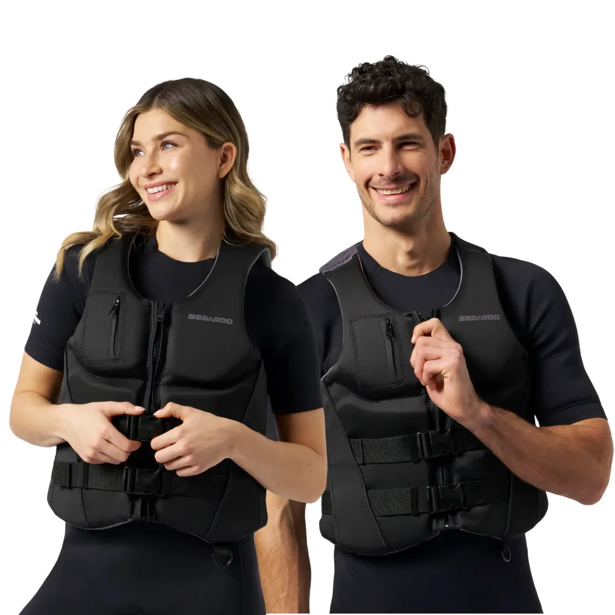 Sea-Doo Wave life jackets (PFDs) in black, worn by a man and a woman; 2 shown.