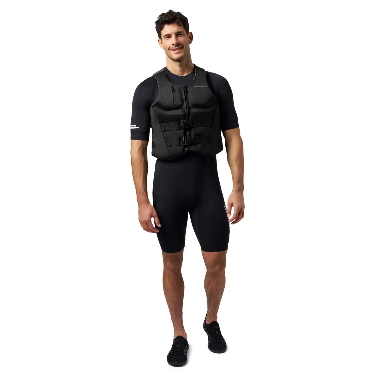 Sea-Doo Wave Life Jacket/PFD, black, with front buckles, worn by a man