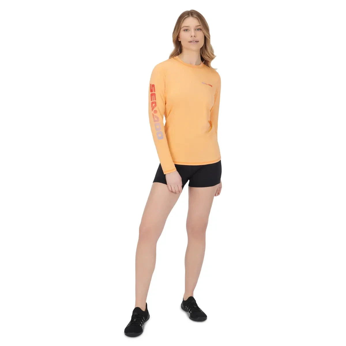 Sea-Doo women's coral long-sleeve rashguard riding gear with BRP logo on sleeve
