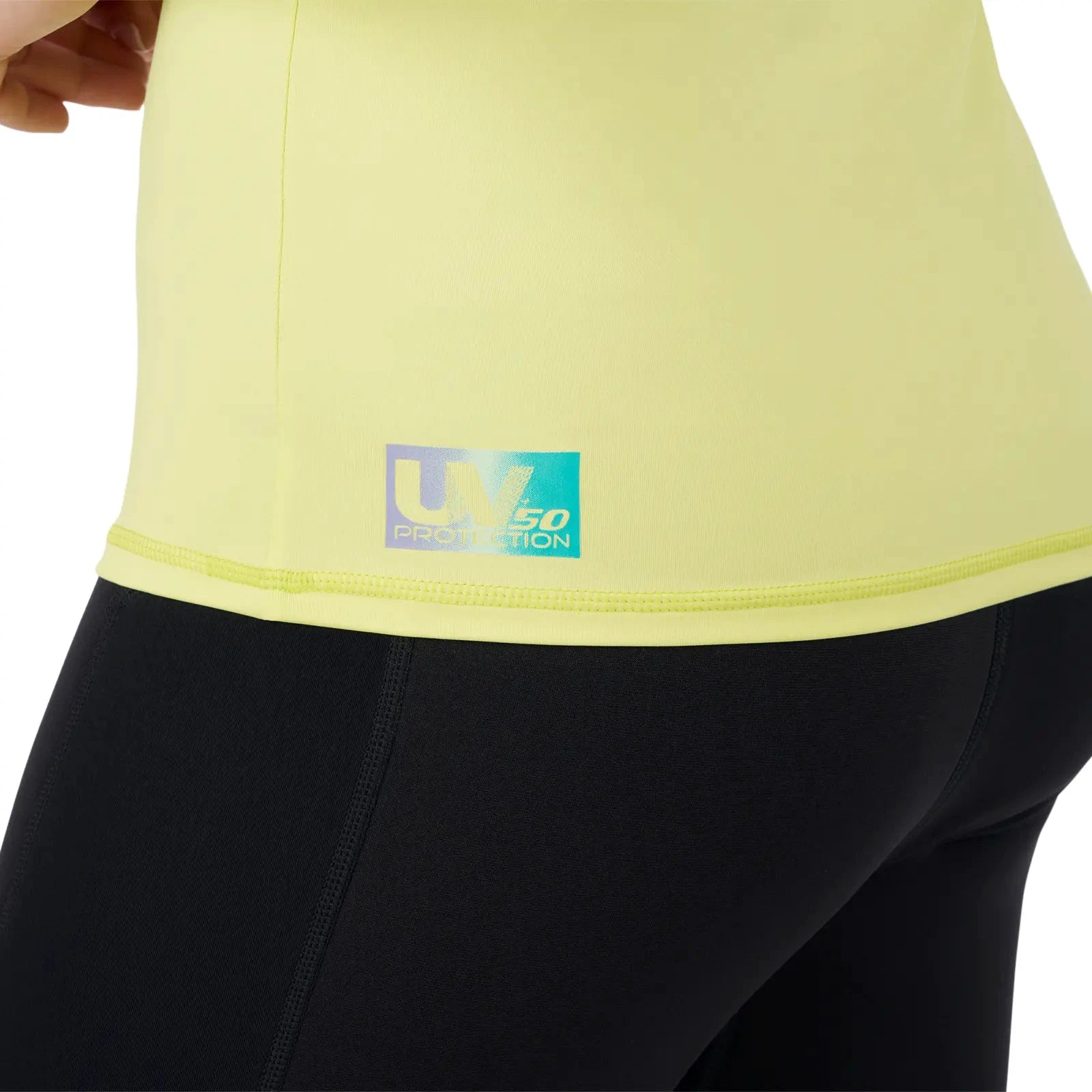 Sea-Doo women's yellow long-sleeve rashguard with UV 50 protection label on the hem
