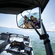 Sea-Doo Switch Rearview Mirror, bimini-mounted, black frame; reflects a group of friends on a watercraft.