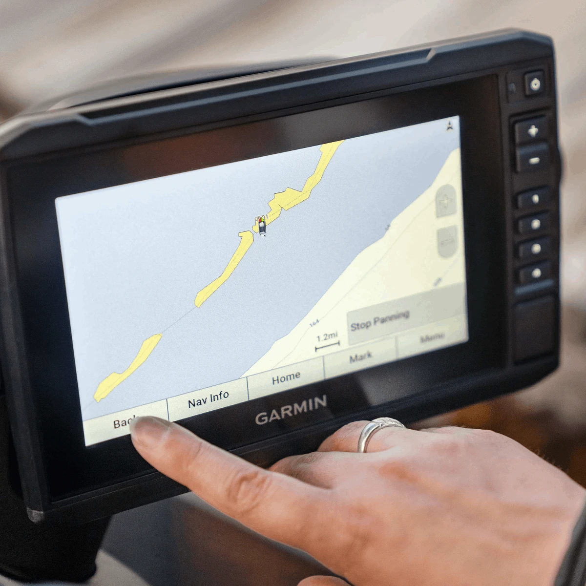 Garmin ECHOMAP UHD 72SV GPS navigation display on Sea-Doo Switch; black marine chartplotter with yellow coastline map