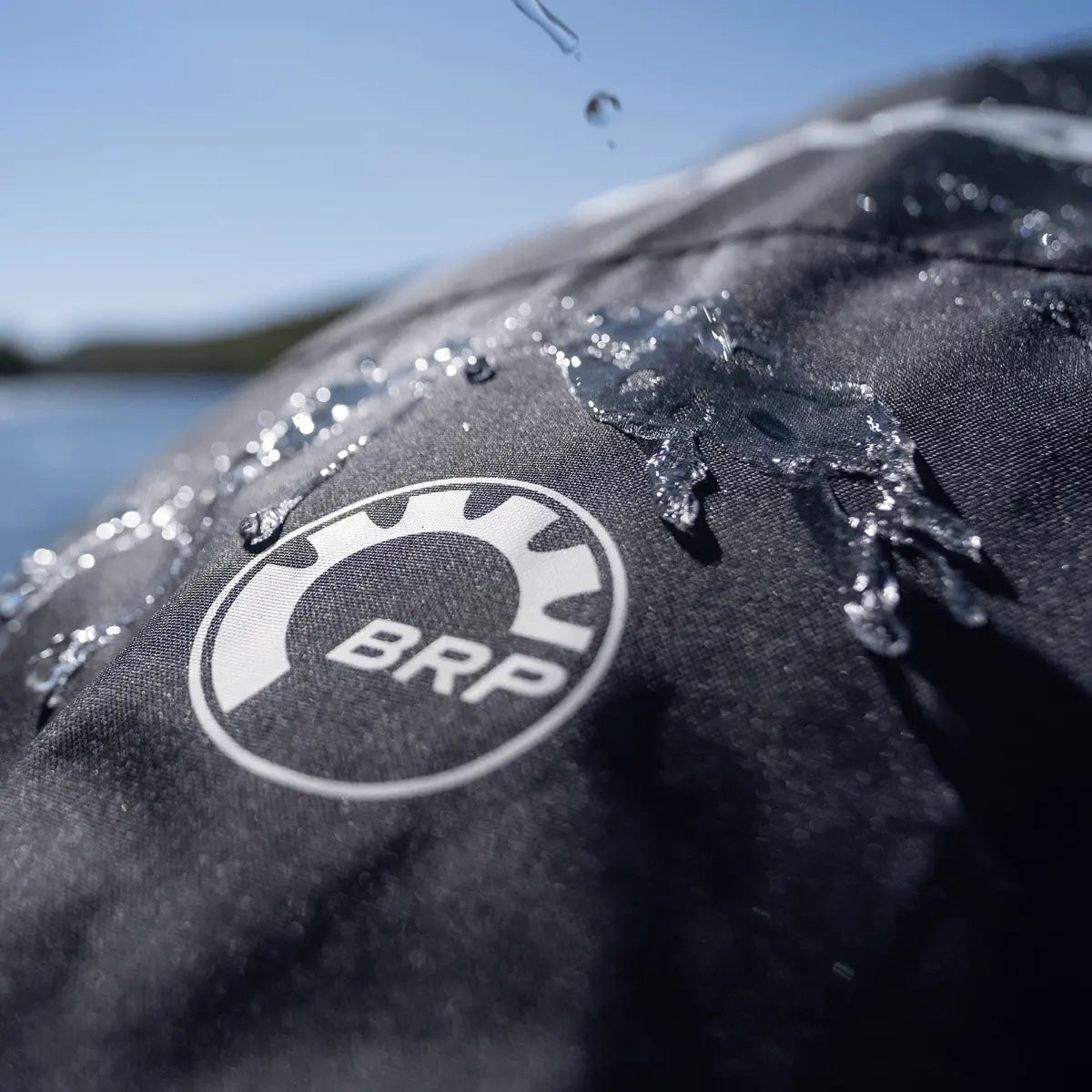 Sea-Doo BRP PWC cover, black fabric with BRP logo and water droplets.