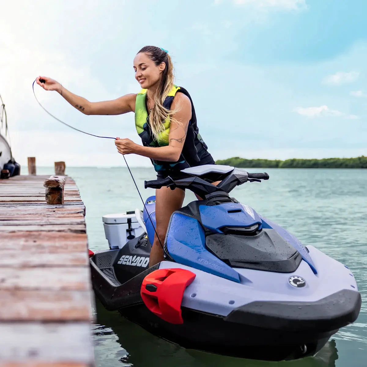Sea-Doo Spark Speed-Tie docking accessory; blue Sea-Doo jet ski secured to a wooden dock with a line.