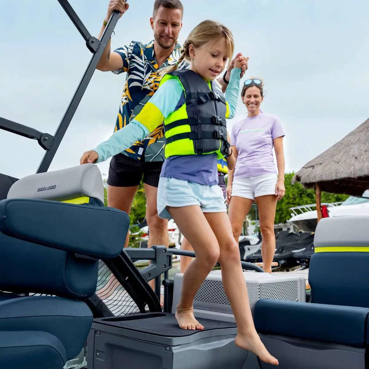 Sea-Doo Switch LinQ Modular Step boat ladder accessory; gray/blue frame shown with a family boarding.