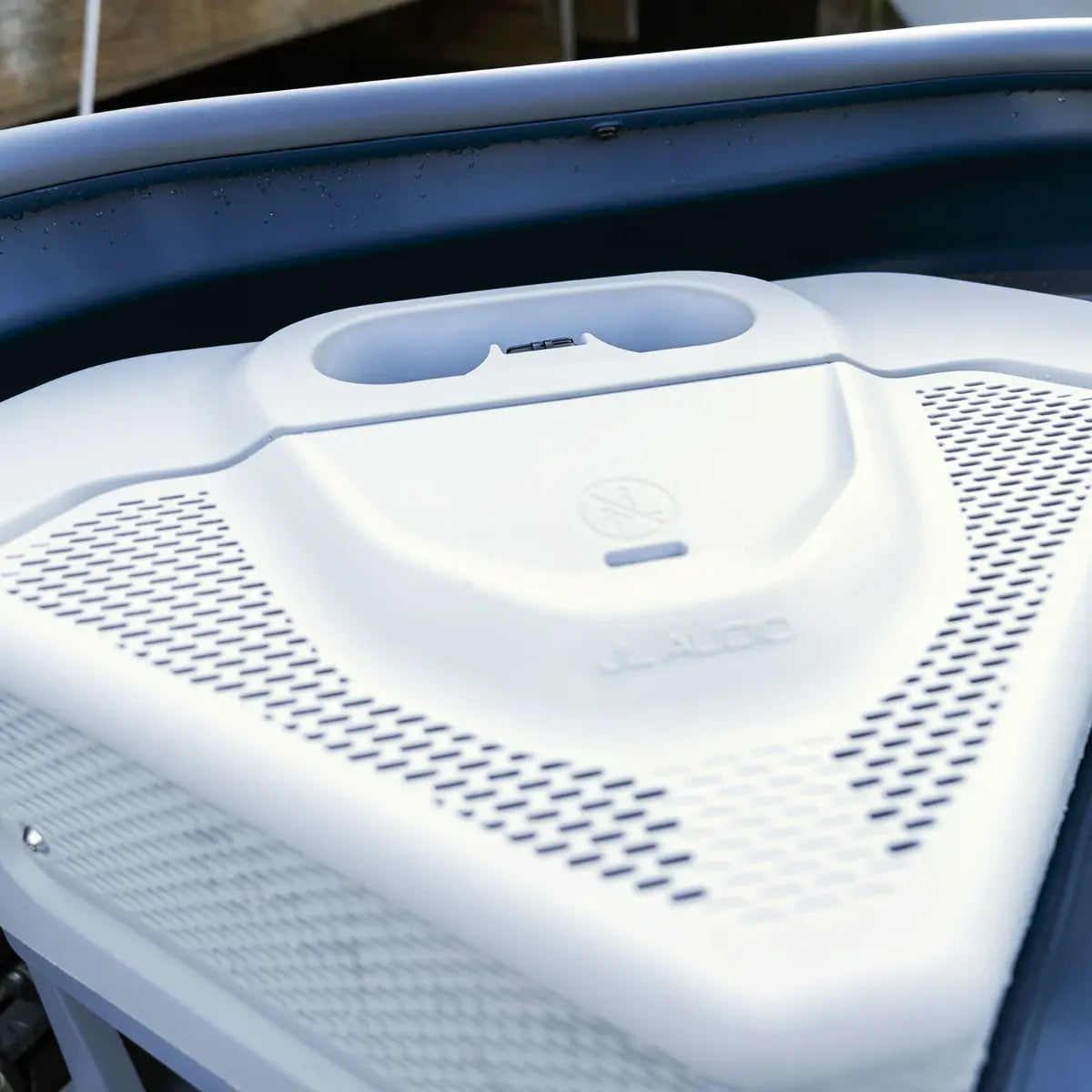 Sea-Doo Switch JL Audio system panel on white watercraft deck with perforated speaker grills