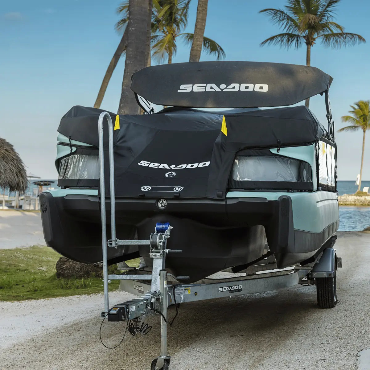 Sea-Doo Switch Sport 18 mooring and trailering cover on a boat trailer; black fabric with Sea-Doo logo