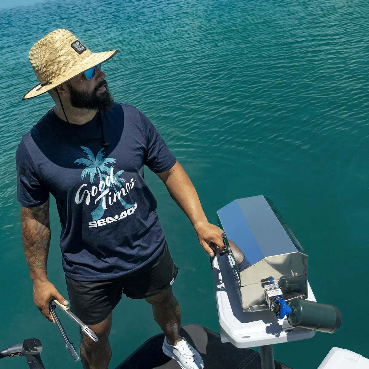 Sea-Doo Switch BBQ Table with LinQ Lite mounted on a watercraft; stainless steel accessory