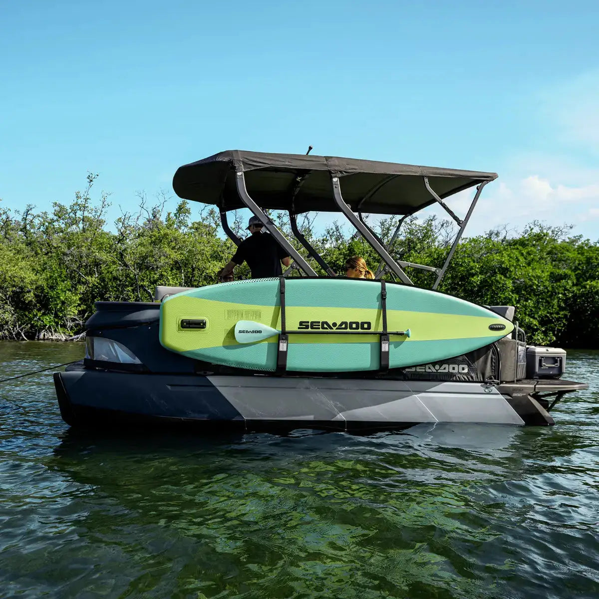 Sea-Doo Switch Pontoon Stand Up Paddle Board Holder on BRP Sea-Doo pontoon with turquoise SUP mounted