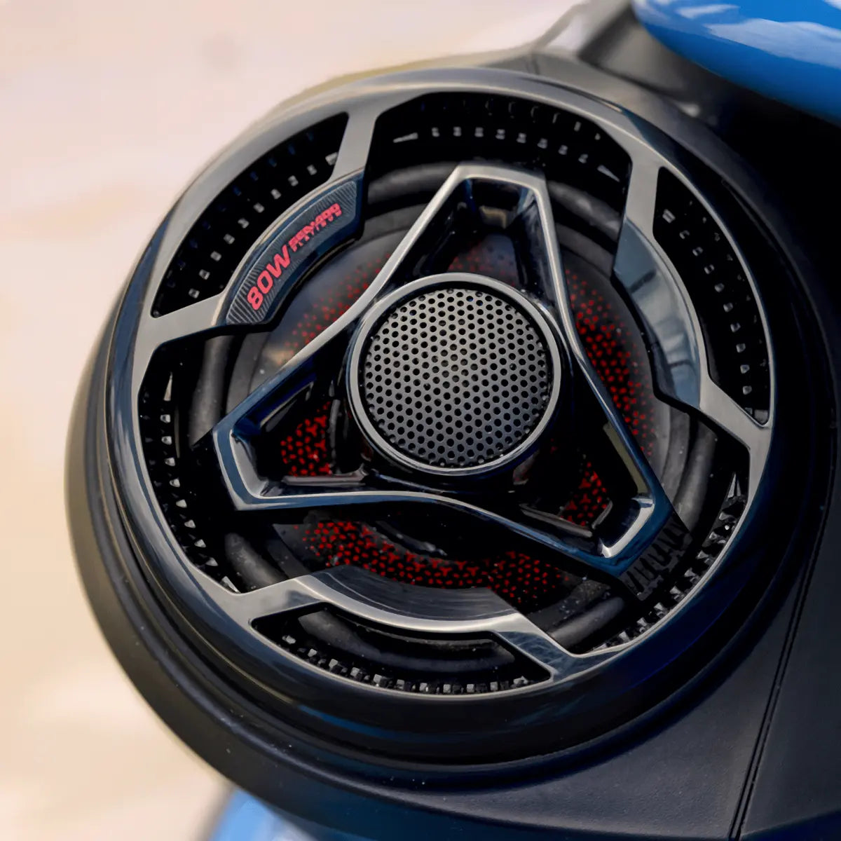 Sea-Doo 80W Platinum audio speaker kit; close-up of black perforated grille with red accents.