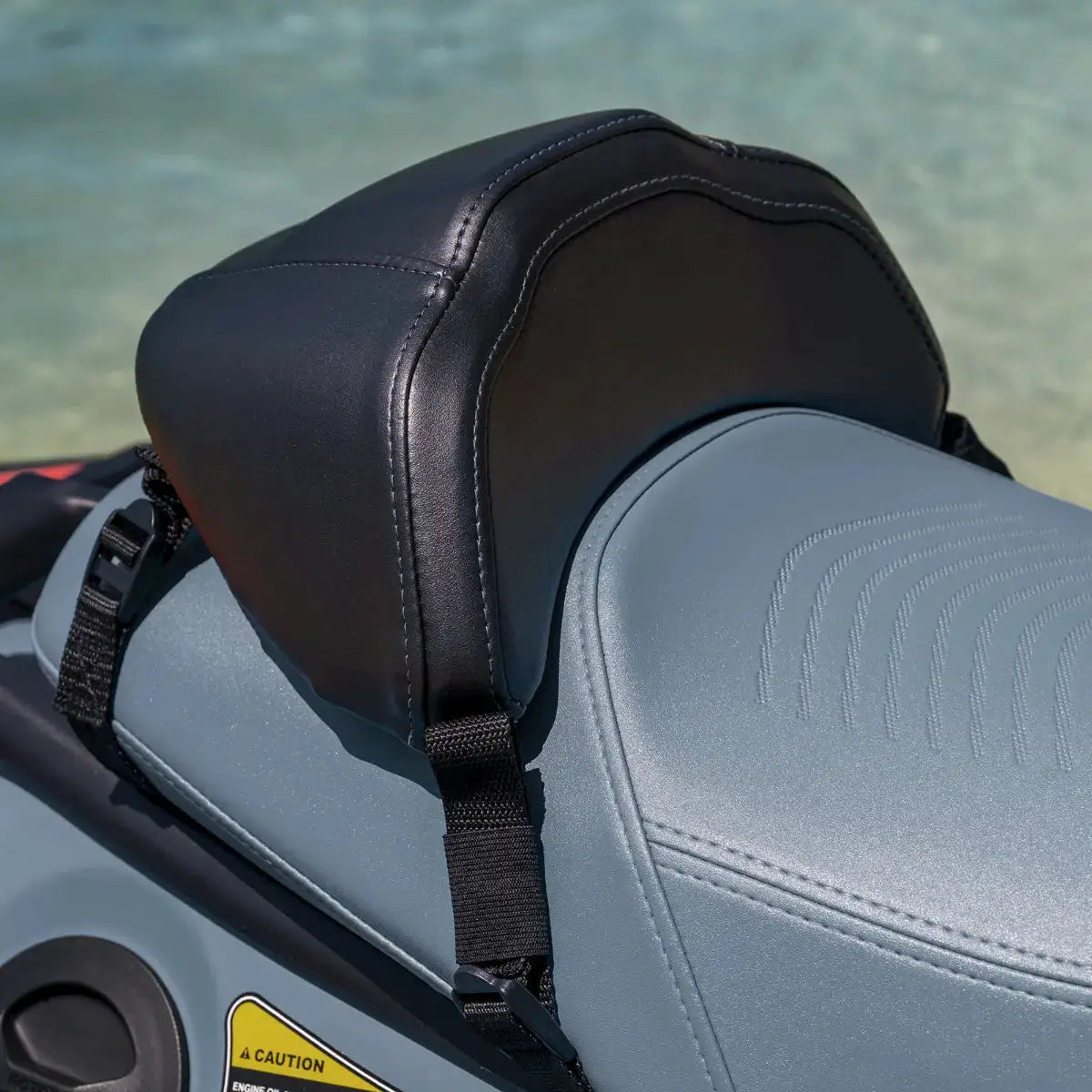 Sea-Doo Spark Performance Saddle, BRP Sea-Doo; black faux-leather seat with white stitching on gray watercraft seat.