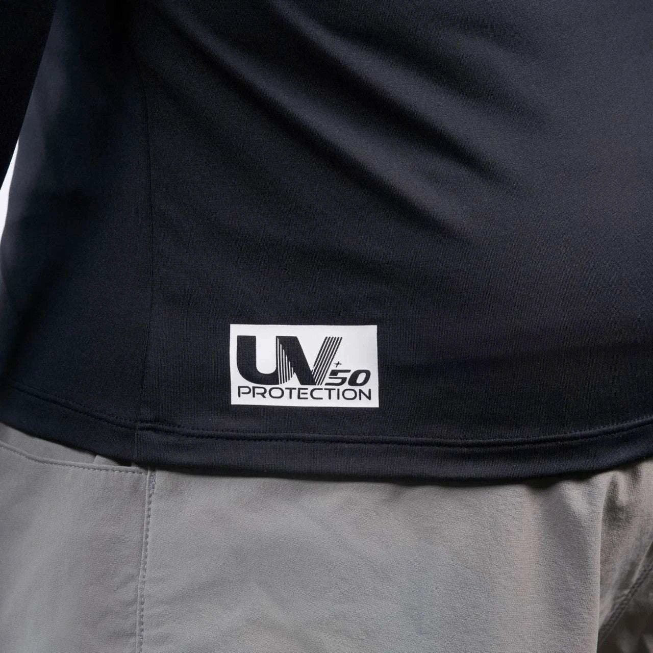 Sea-Doo men's long-sleeve rash guard in black with UV 50 protection label at the hem.