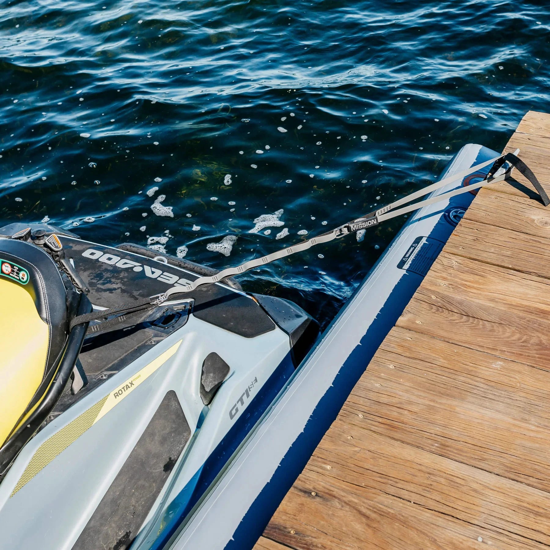 Mission Outdoors PWC Tethers dock lines in gray, shown attached to a jet ski at a wooden dock, sold in pairs.