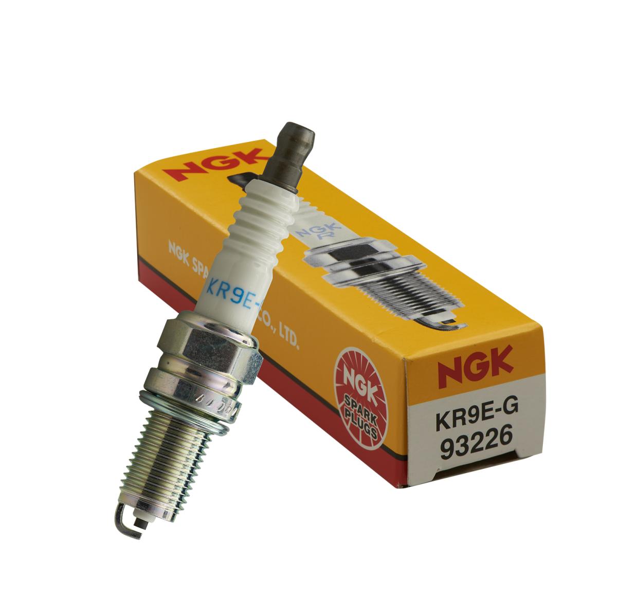 NGK Spark Plug KR9E-G with yellow NGK box, featuring white ceramic insulator and metal threaded shell.