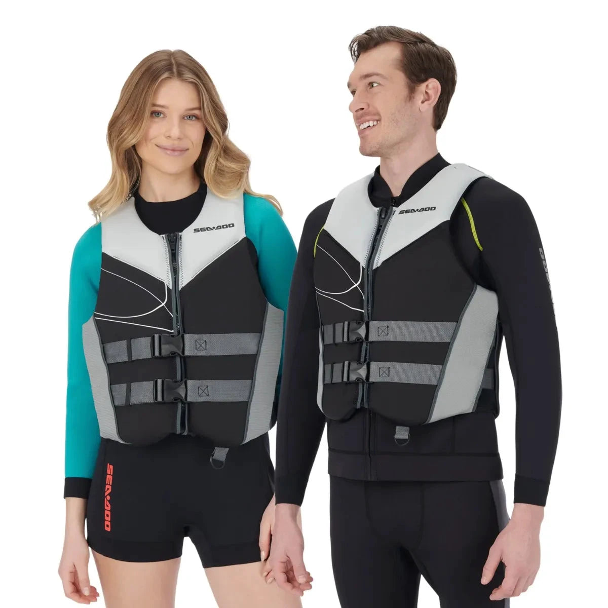 Sea-Doo Freedom Stream PFD Life Jacket, black with gray panels, worn by a man and woman