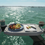 Sea-Doo Switch Rail Service Table, gray plastic tray with fruit plate and cutting board on a watercraft