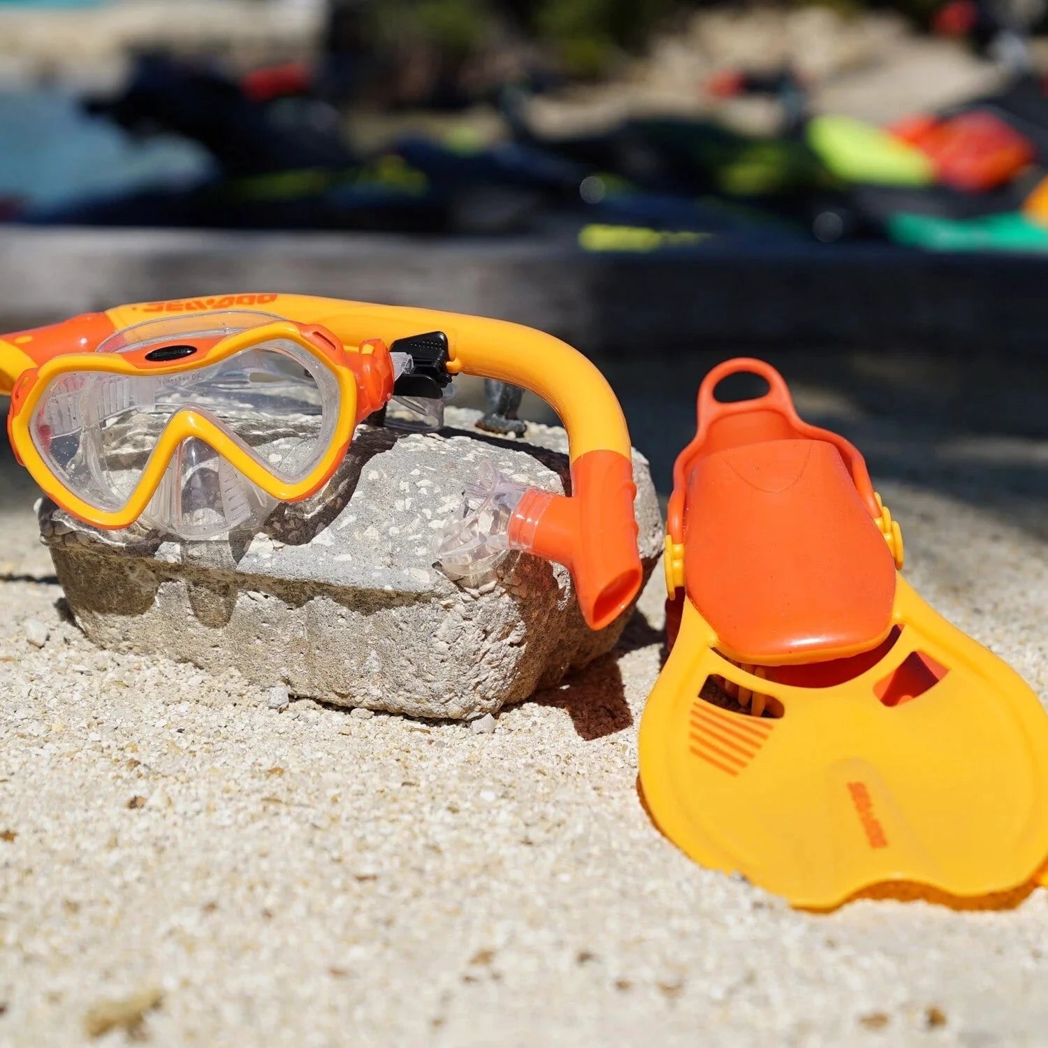 Sea-Doo snorkeling set for youths S/M; 3-piece orange mask and snorkel with yellow fins, new with mesh carry bag.
