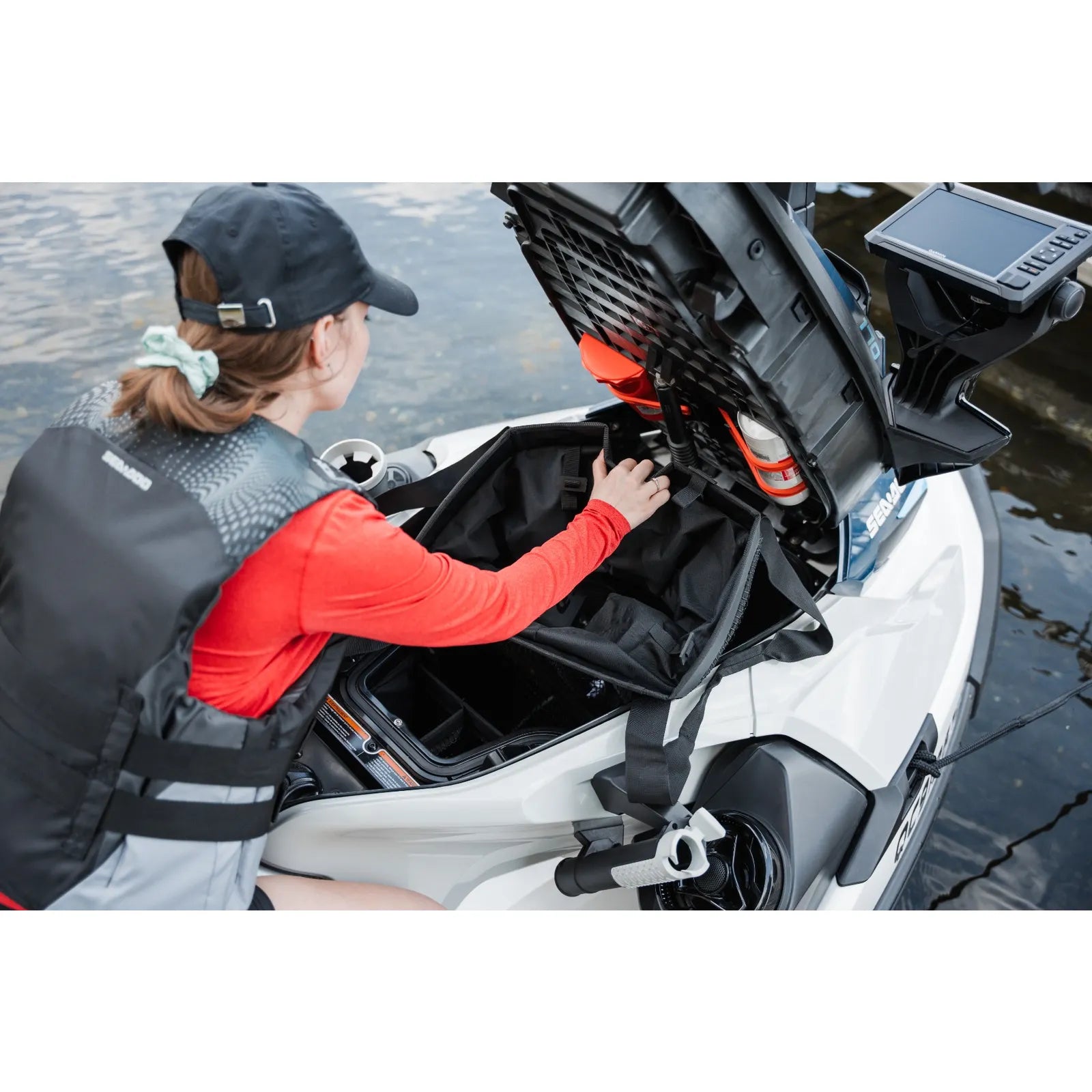 Sea-Doo 9.8 US gal removable storage bin organizer, black, installed in a jet ski storage compartment