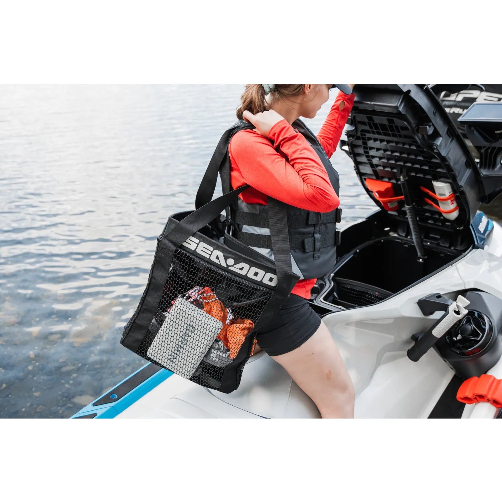 Sea-Doo removable storage bin organizer mesh bag, black with white SEA-DOO logo on rider's gear