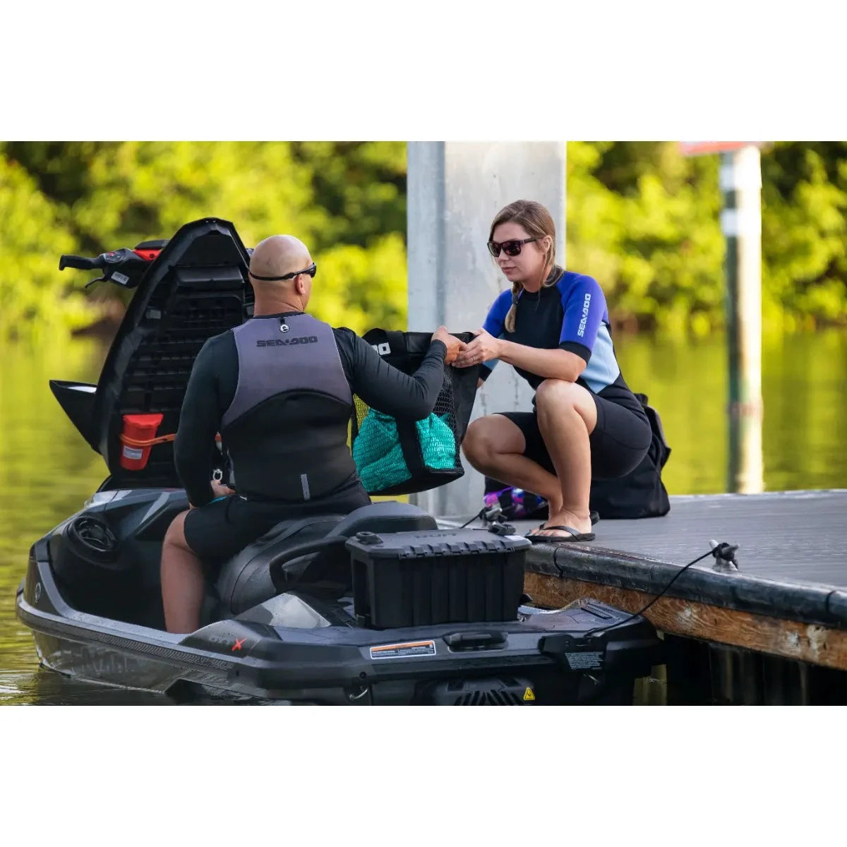 Sea-Doo LinQ 5 US Gal modular cargo box, black plastic, mounted on a Sea-Doo watercraft for on-water gear storage.