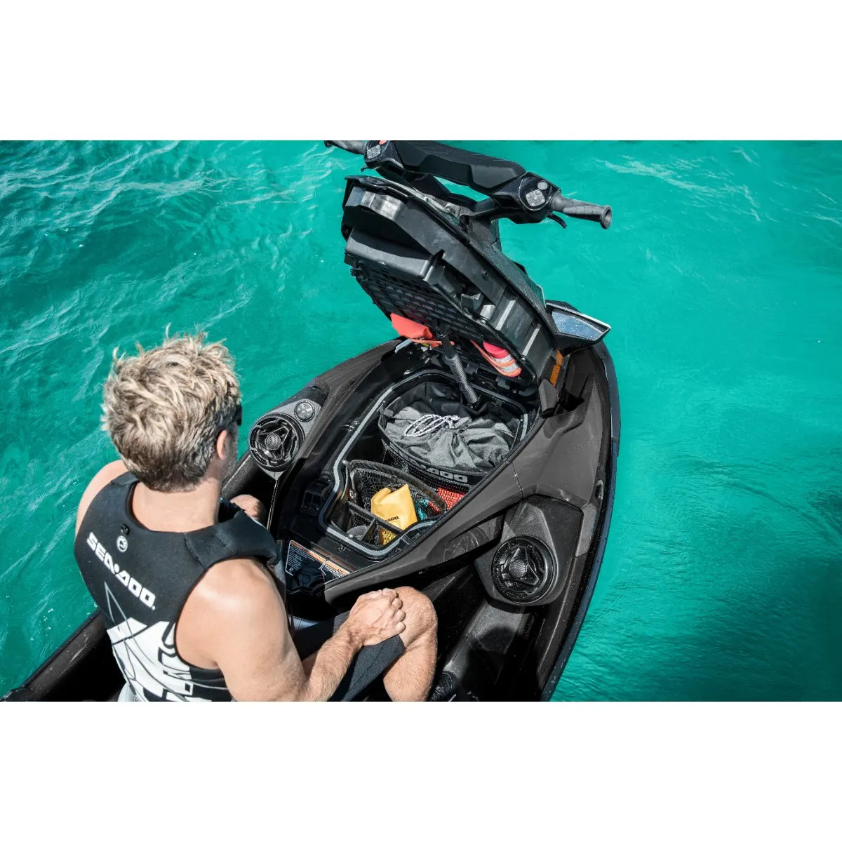 Sea-Doo 9.8 gal removable storage bin organizer on a black Sea-Doo personal watercraft, turquoise water