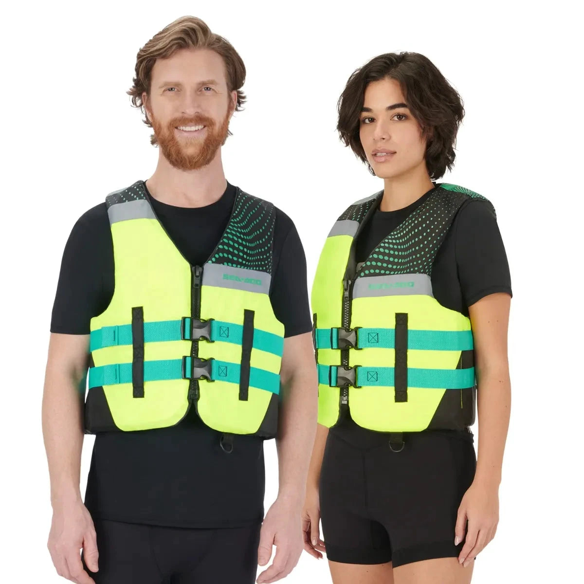 Sea-Doo Motion Life Jacket PFDs, neon yellow with teal straps, worn by two models.